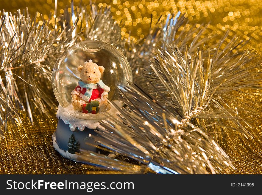 Christmas bear in shiny tinsel