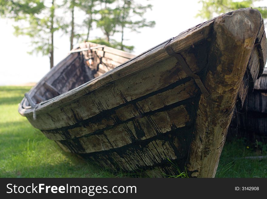 Old wooden fishing boat on the Baikal lakeside