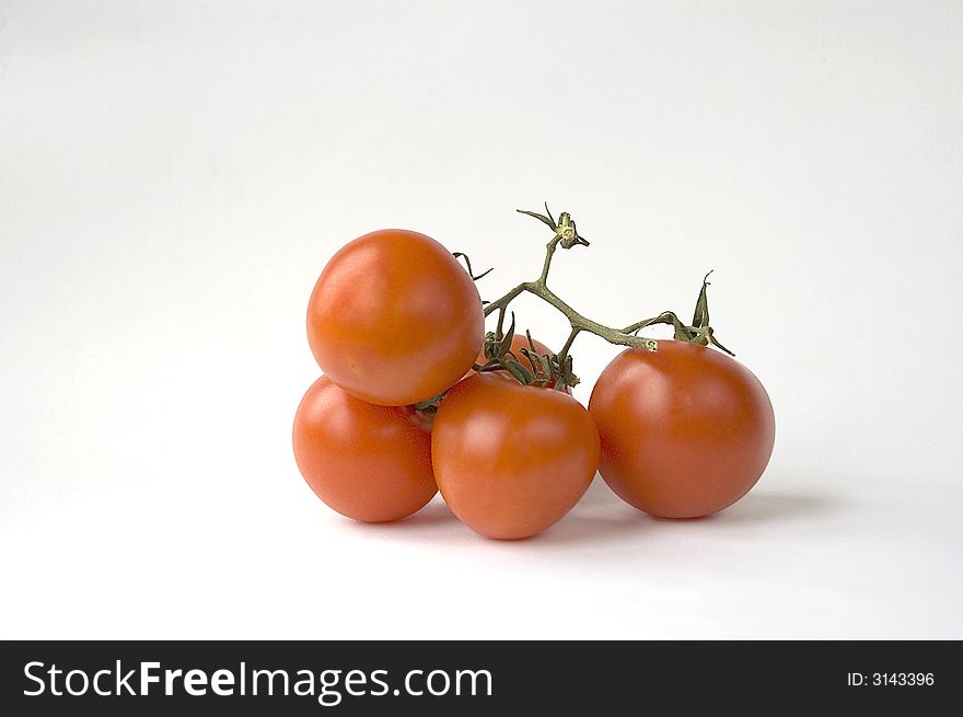 Cluster red a tomato, isolated on white. Cluster red a tomato, isolated on white