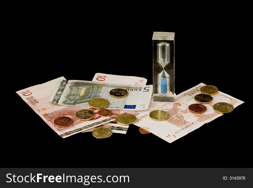 Dollar and hour glass isolated over black background. Dollar and hour glass isolated over black background