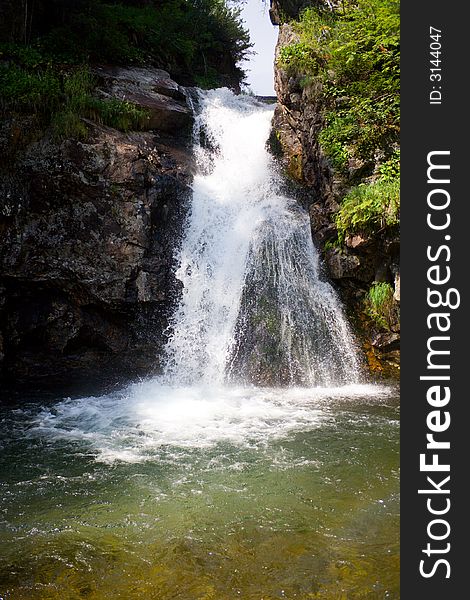 Waterfall grohotun (thunderer) on the same name brook (foothills of Sayan's mountain range)