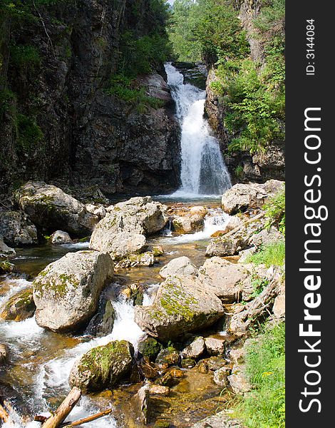 Waterfall grohotun (thunderer) on the same name brook (foothills of Sayan's mountain range)