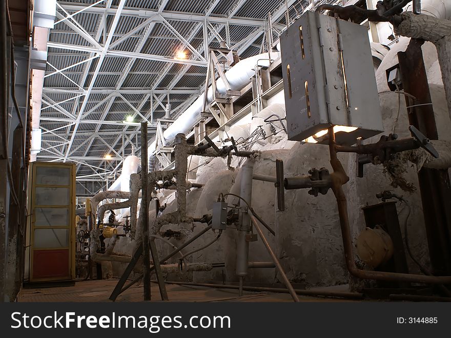 Different types of pipes and tanks inside energy plant. Different types of pipes and tanks inside energy plant