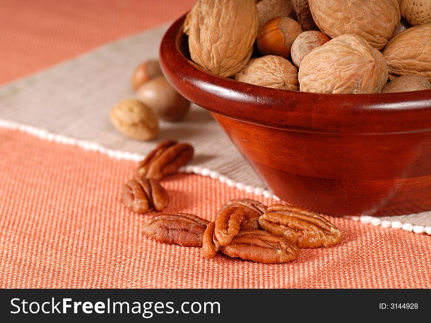 A bowl of mixed nuts in their shells