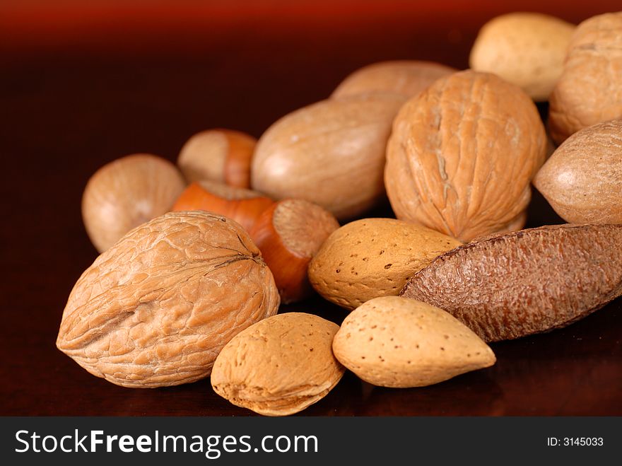 An assortment of fresh whole nuts on a table