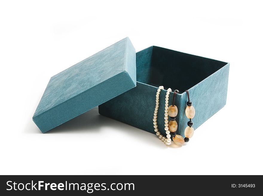 Box with jewels on white background