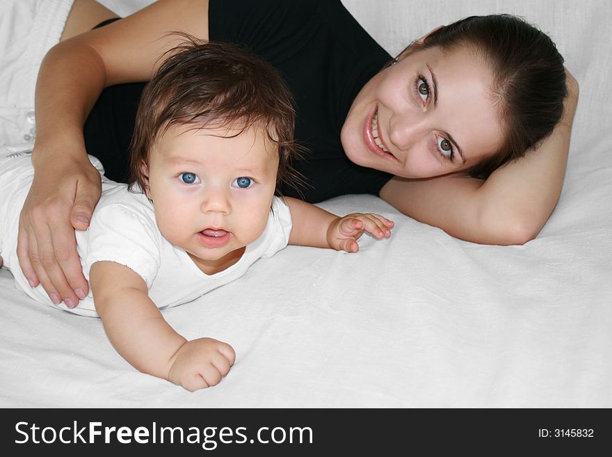 Tender young mother and happy child together. Tender young mother and happy child together