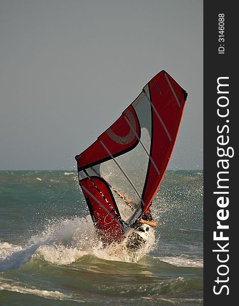 Windsurfers during a wrong freestyle moves. Windsurfers during a wrong freestyle moves