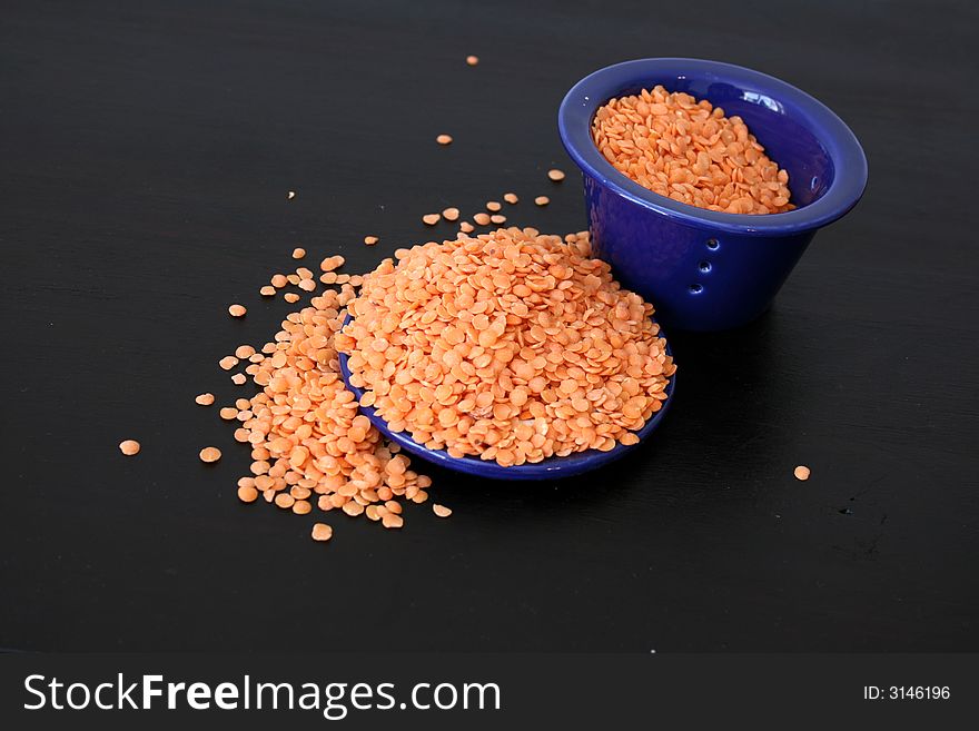 Lentils in a blue ceramic bowl and lid