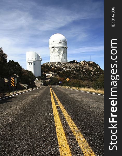 Yellow lines on the road and observatory domes. Yellow lines on the road and observatory domes.