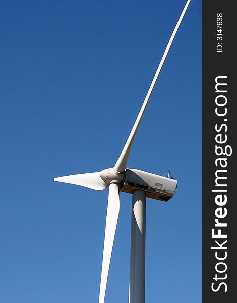 Rotor head of a windmill with three blades. Rotor head of a windmill with three blades.