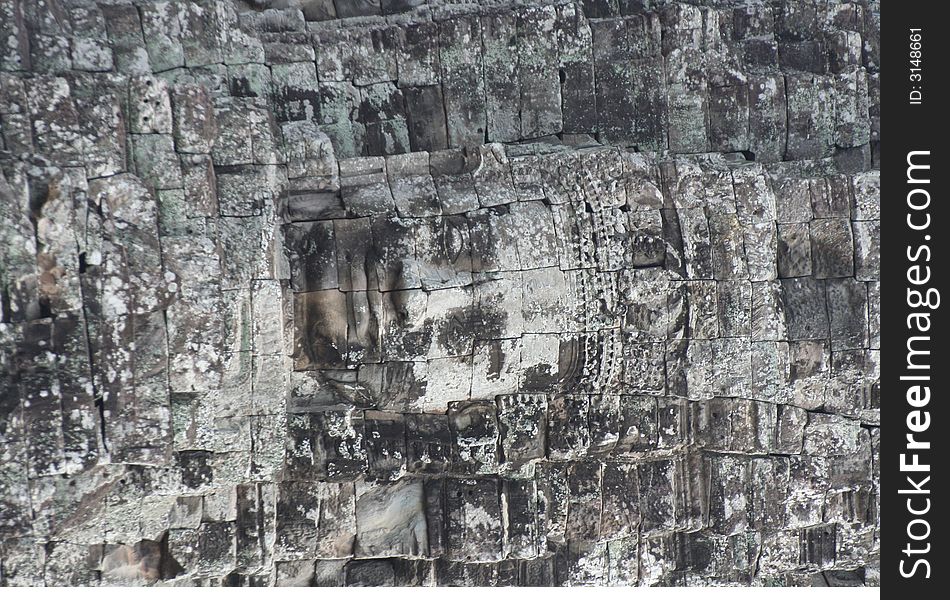 Angkor wat bayan face on temple wall