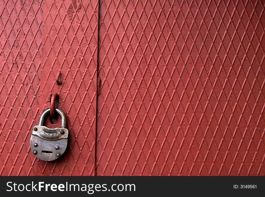 An image of metallic door with  lock. An image of metallic door with  lock