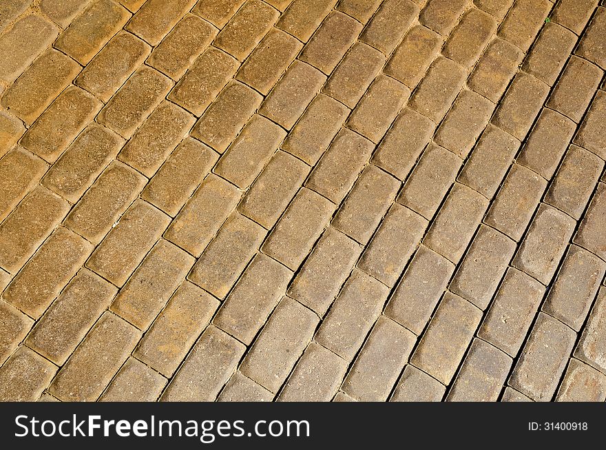 Diagonal pavement pattern made from yellow bricks