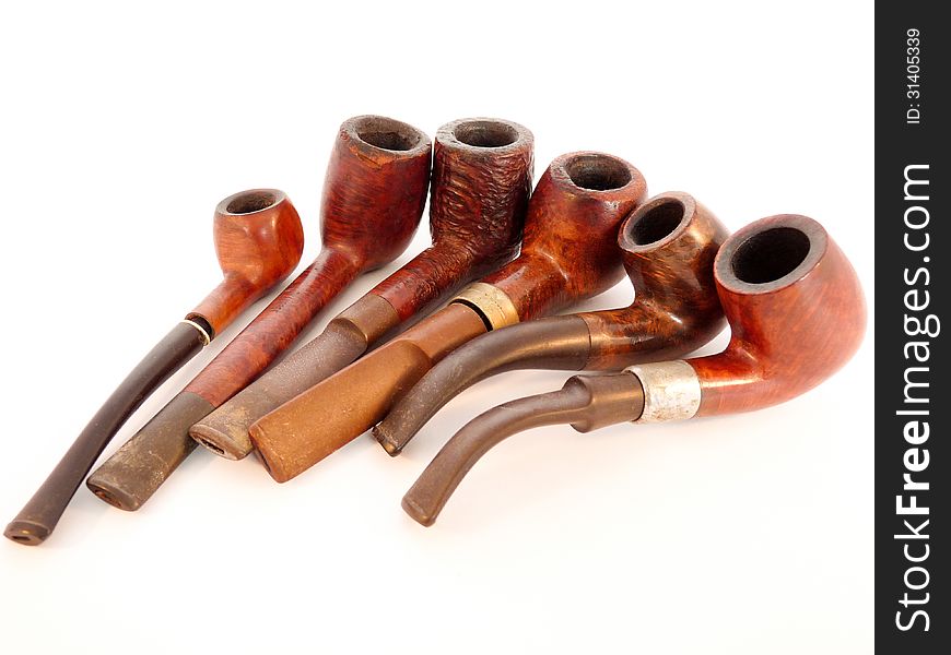 Six Smoking Pipes Lying Together Isolated On White