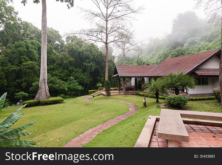 House in the valley and fog above the roof. House in the valley and fog above the roof