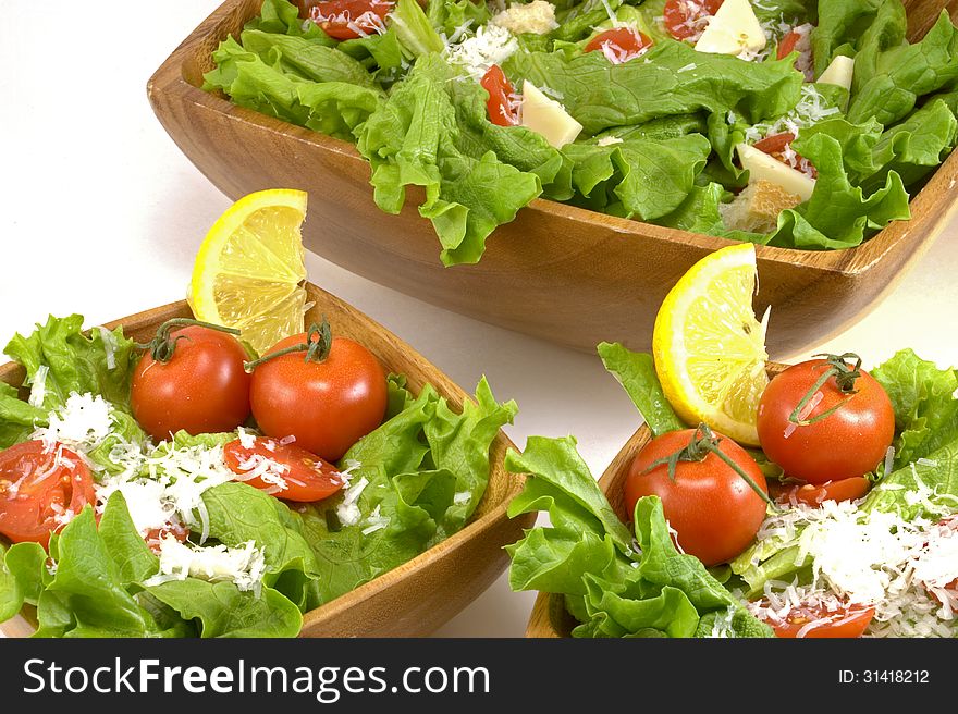 Three bowls of salad on a white background. Three bowls of salad on a white background.