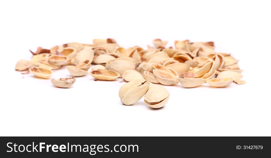 Peel pistachios on a white background