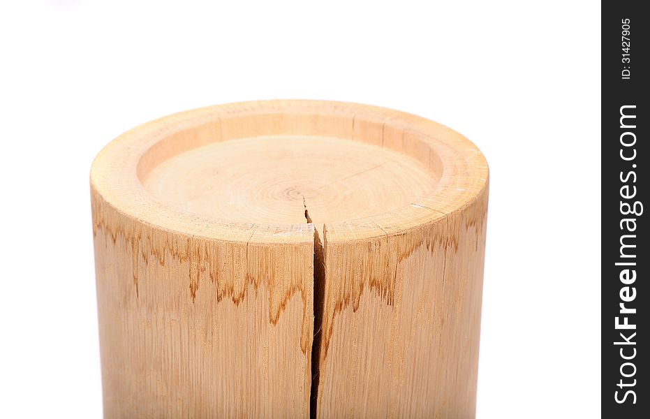 A cylindrical timber with a crack on a white background