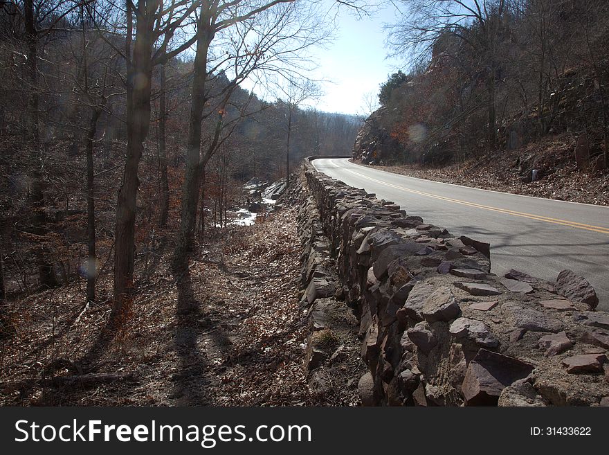 A wall beside a rural road. A wall beside a rural road.