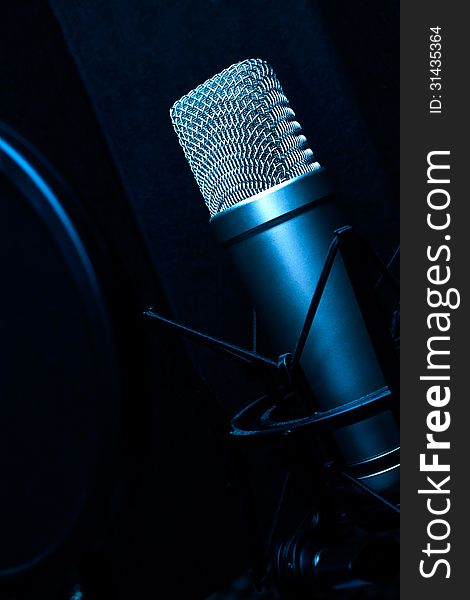 Condenser microphone in recording studio. Condenser microphone in recording studio