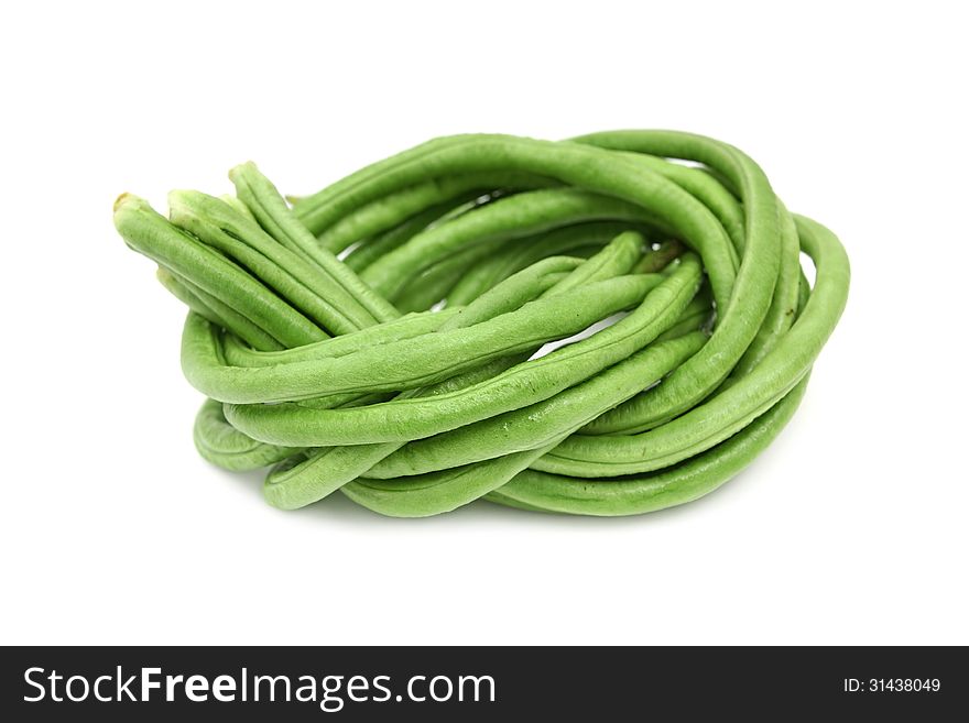 Green lentils,beans tied and coiled on white background