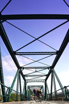 Bicycle On Historical Iron Bridge, Cloudy And Blue Sky Stock Photos Bicycle On Historical Iron Bridge, Cloudy And Blue Sky Stock Photos