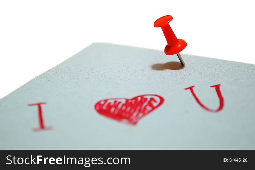 Blue piece of paper with a note, pinned a red pin on a white background. Blue piece of paper with a note, pinned a red pin on a white background