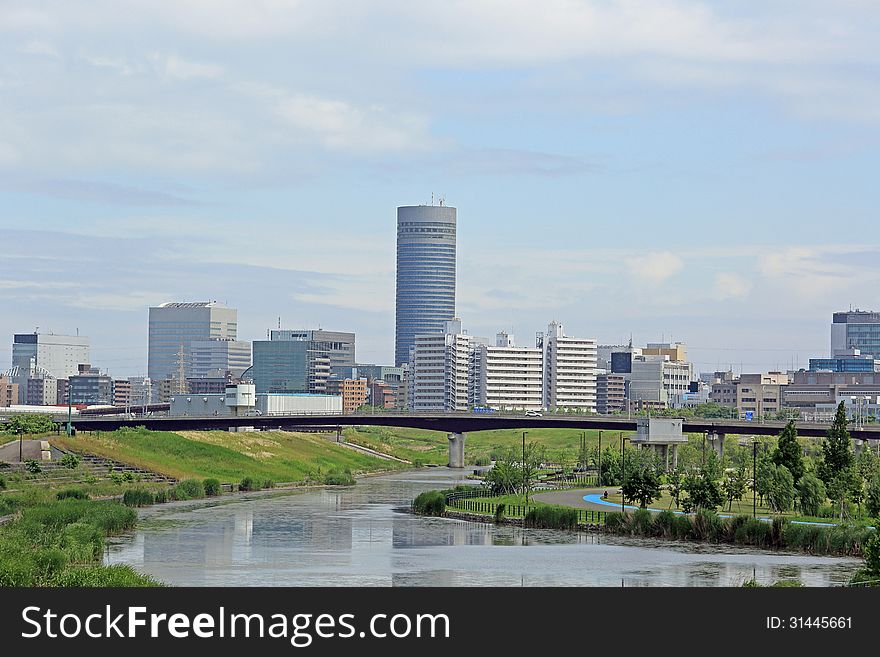 Photographed Shin-Yokohama from the park that is located in the waterside. Photographed Shin-Yokohama from the park that is located in the waterside.