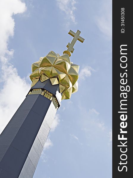 Cross at the top of Monument to heroes of the Borodino battle on Rajevski battery against the bright sky. Cross at the top of Monument to heroes of the Borodino battle on Rajevski battery against the bright sky.