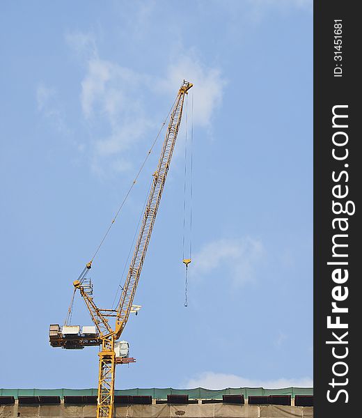 Crane on top of building in Construction site