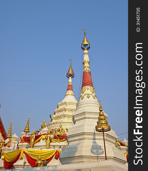 White double pagoda with goden decoration at wat songtham, Phra Pradaeng, Samut Prakan province, Thailand