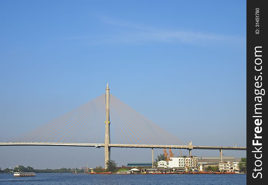 View of Bhumibol bridge across Chao Phraya river and ferry port at Phra Pradaeng, Samut Prakan province, Thailand. View of Bhumibol bridge across Chao Phraya river and ferry port at Phra Pradaeng, Samut Prakan province, Thailand