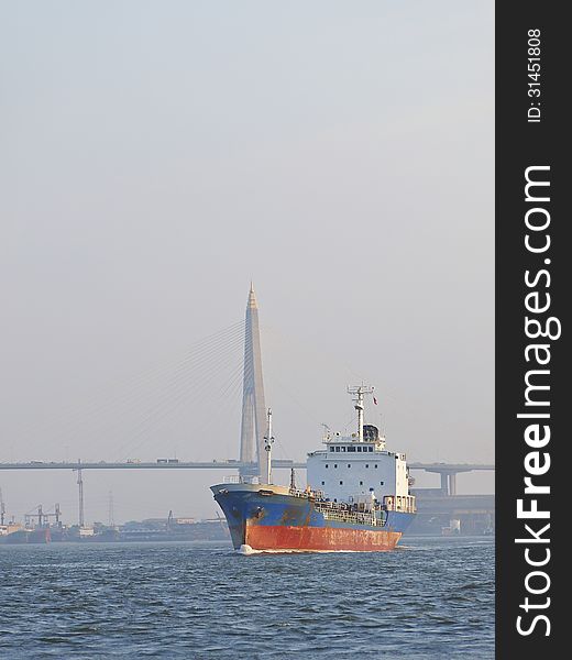 Ship in Chao Phraya River in background of Bhumibol bridge, Thailand. Ship in Chao Phraya River in background of Bhumibol bridge, Thailand