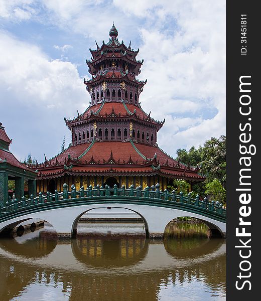 Chinese red pagoda with a bridge cross over a canal