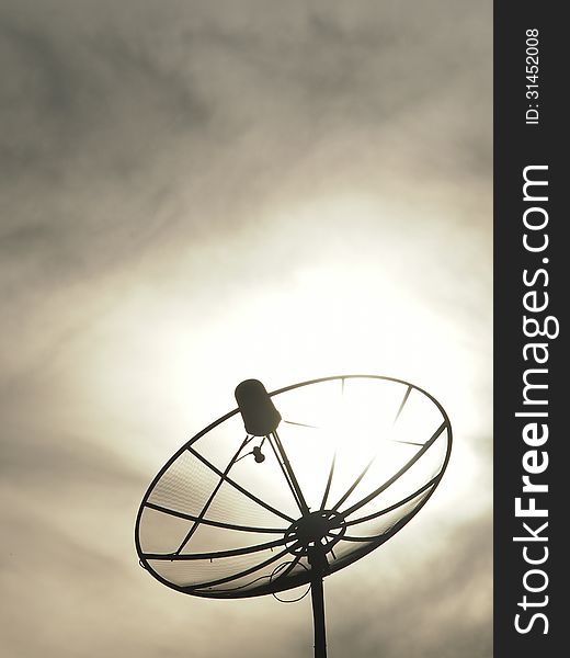 Silhouette image of satellite dish in cloudy day. Silhouette image of satellite dish in cloudy day