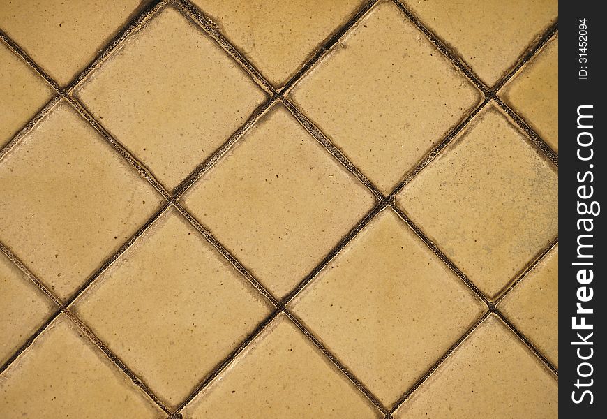 Part of surface of old pale yellow tile. Part of surface of old pale yellow tile