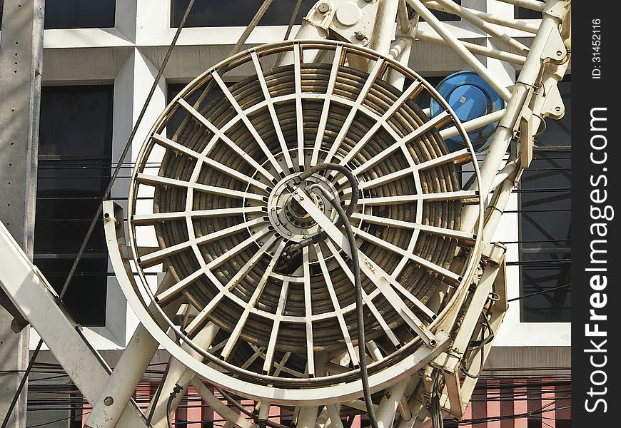 Wheel of hydraulic system in heavy machine in sunlight. Wheel of hydraulic system in heavy machine in sunlight