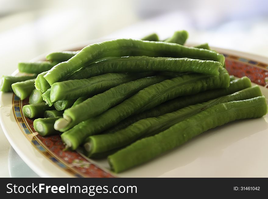 Long green bean on a plate in a restaurant