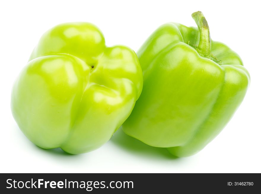 Two Green Bell Peppers isolated on white background