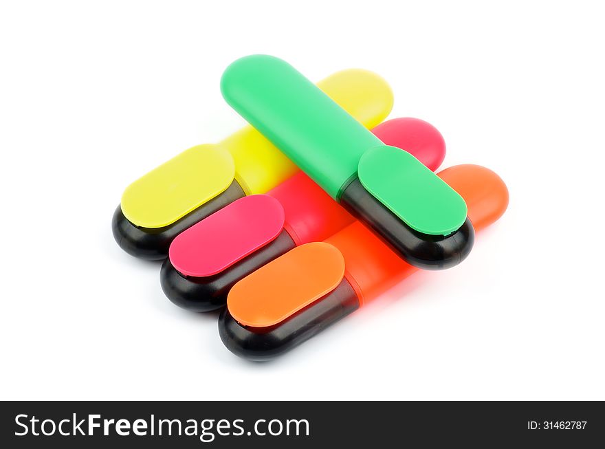 Arrangement of Red, Green, Yellow and Orange Fluorescent Highlighter Pens isolated on white background