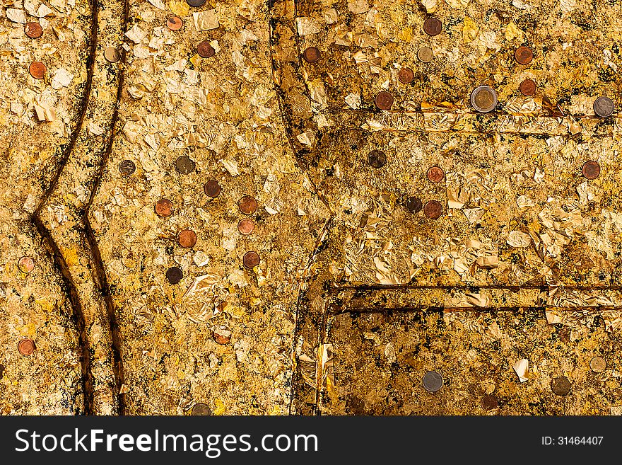 A part of Buddha image with gold leaf