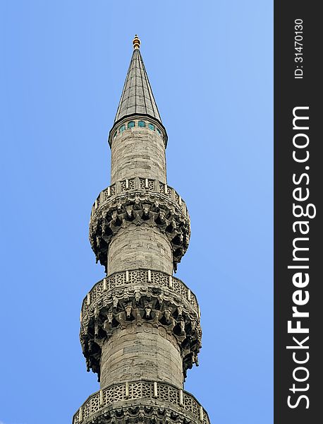 Minaret against clear blue sky, view from below. Minaret against clear blue sky, view from below