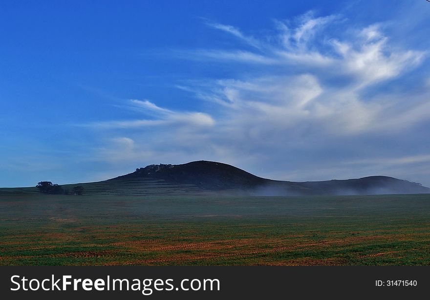 Landscape of farmland with hill early in the morning. Landscape of farmland with hill early in the morning