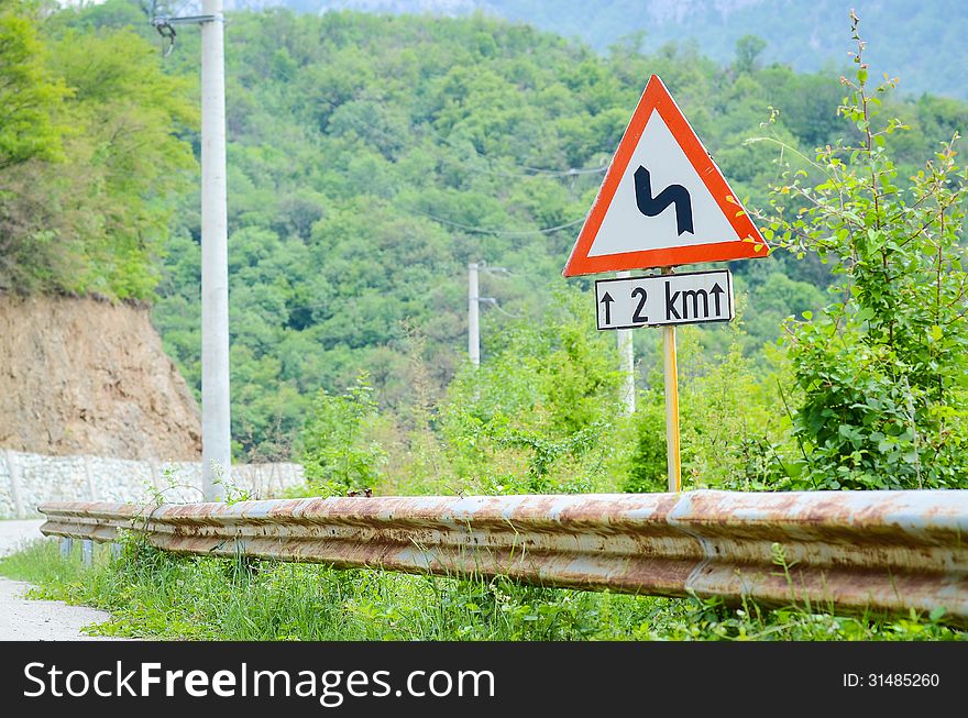 Traffic Curve road sign on a rural area