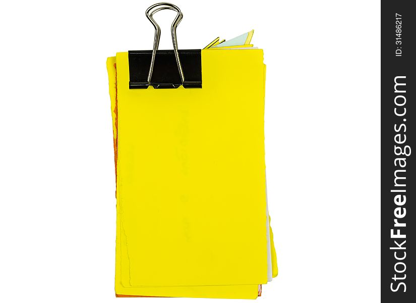 Untidy yellow notepad with binder isolated