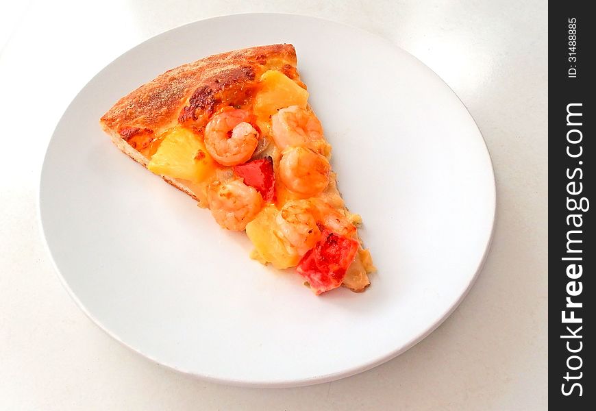 Cut off slice pizza on white dish