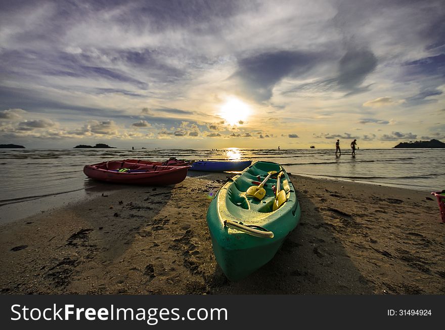 Kayaks sunset on koh chang beach Thailand