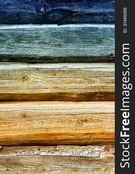 Multicolored wooden beams create a background. Multicolored wooden beams create a background