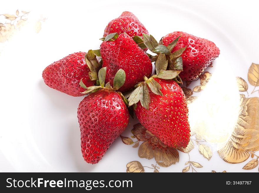 Some fresh strawberry on white dish background